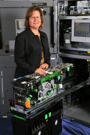 NCR Canada’s Director of Engineering Susan Carreon displays her team’s Scaleable Deposit Module, an ATM that accepts bills and checks for deposit simultaneously.