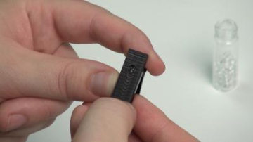 This small 3-D-printed microscope clips to a common smartphone and can magnify up to 1000x. (Photo credit: PNNL)